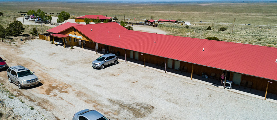 External semi-close elevated videw of the Lodge and additional buildings in the background. 