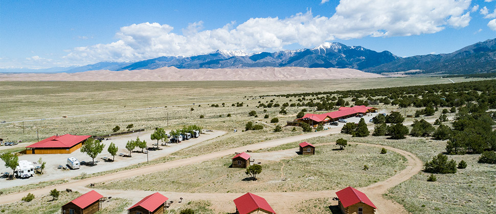 An elevated exterior view of the Lodge's deluxe cabins, and the paths that lead back to the lodge. 