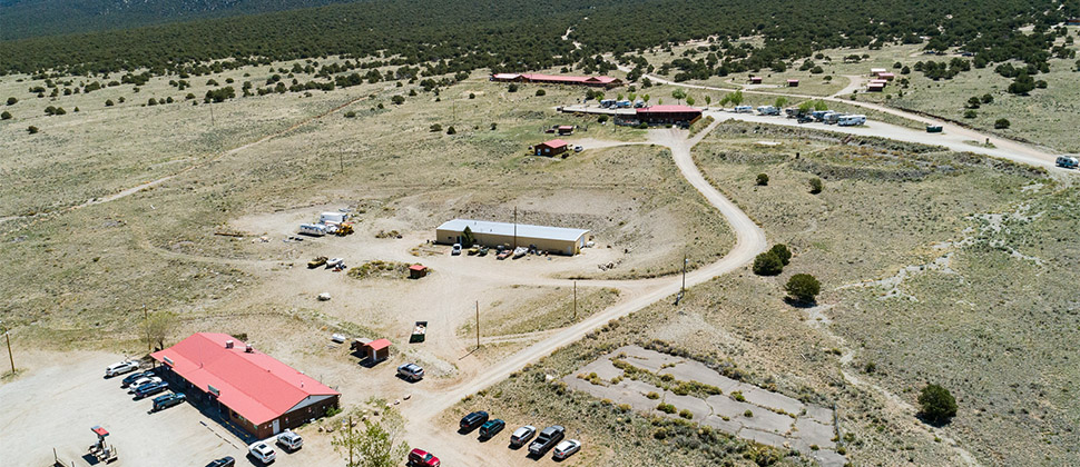 An elevated view over the lodge and back towards the deluxe cabins. 